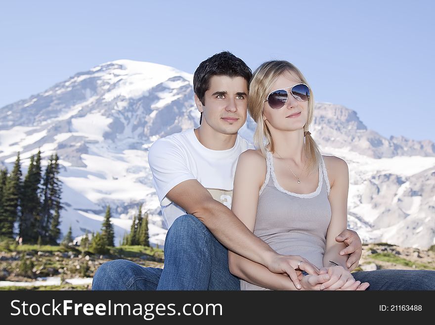 Portrait of a young happy couple together on the mount. Portrait of a young happy couple together on the mount
