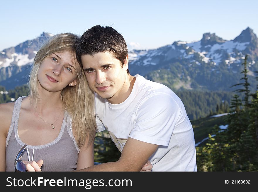 Portrait of a young happy couple together on the mount. Portrait of a young happy couple together on the mount