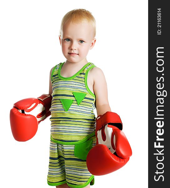 Little boy in red boxing gloves on white background