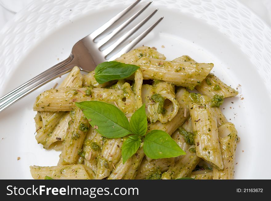 Closeup shot of healthy macaroni pasta on white plate with fork. Closeup shot of healthy macaroni pasta on white plate with fork.