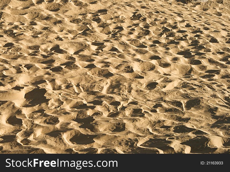 Sand Background With Traces Of Feet