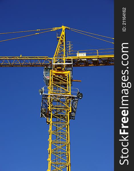 Tower crane in the blue sky