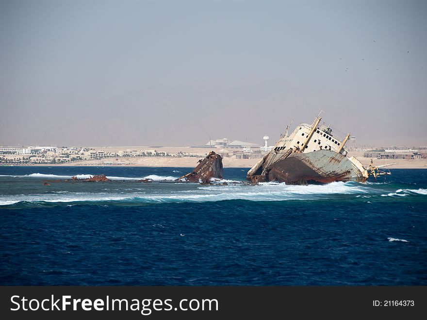 A shipwreck on a reef in the ocean, Egypt. A shipwreck on a reef in the ocean, Egypt