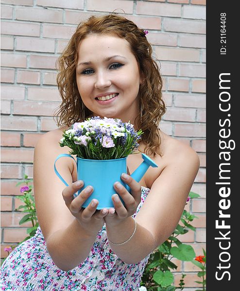 Attractive young girl with flower bouquet