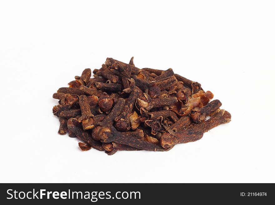 Heap of cloves, isolated on white background.