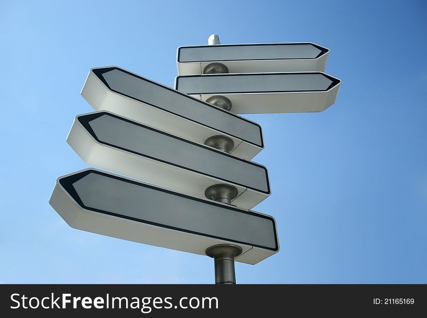 Empty road sign on blue sky background