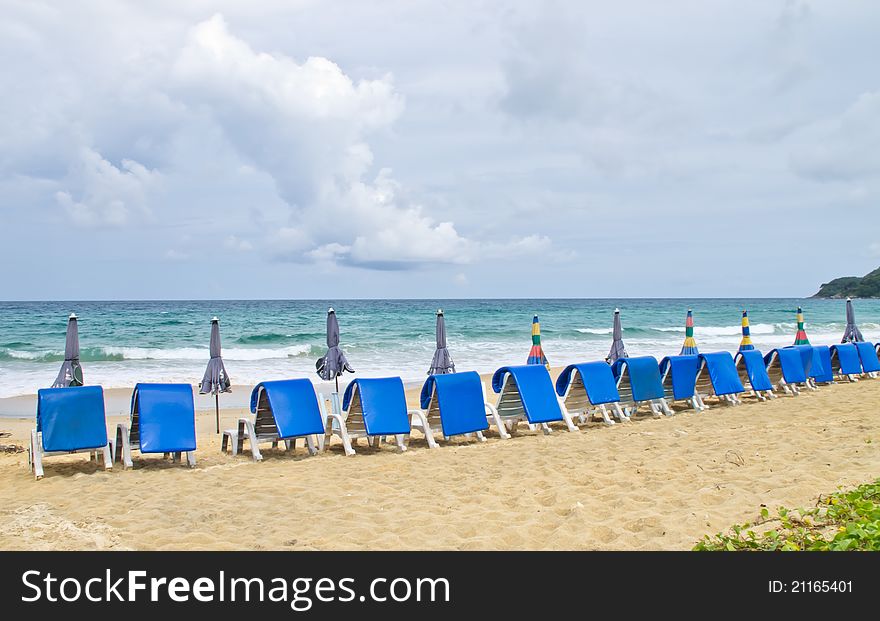 Beach chairs and  umbrella on beach. Beach chairs and  umbrella on beach