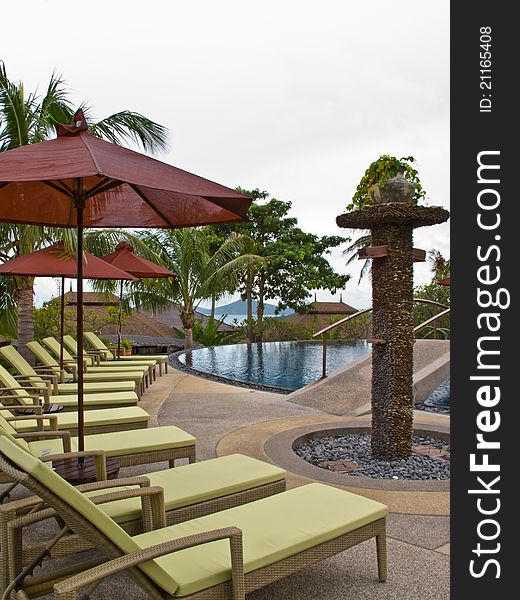 Beach chairs and umbrella on swiming pool. Beach chairs and umbrella on swiming pool