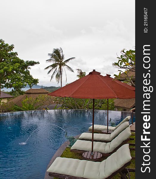 Beach chairs and umbrella on swiming pool. Beach chairs and umbrella on swiming pool