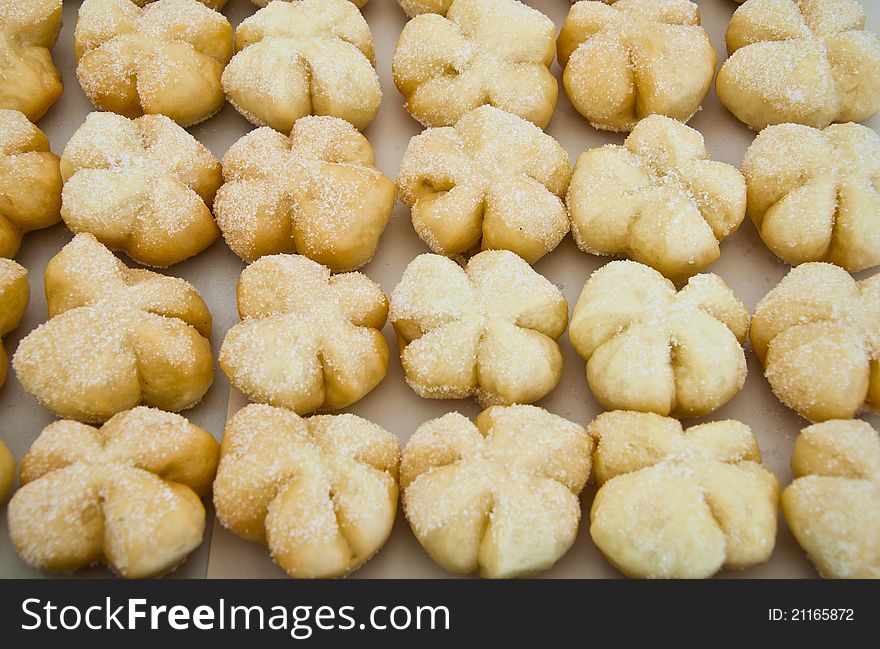 Row of fancy bread with sugar surface for sale and marketing