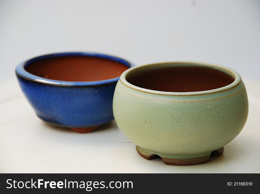 Small bonsai bowls on kusamono or mini bonsai. Small bonsai bowls on kusamono or mini bonsai