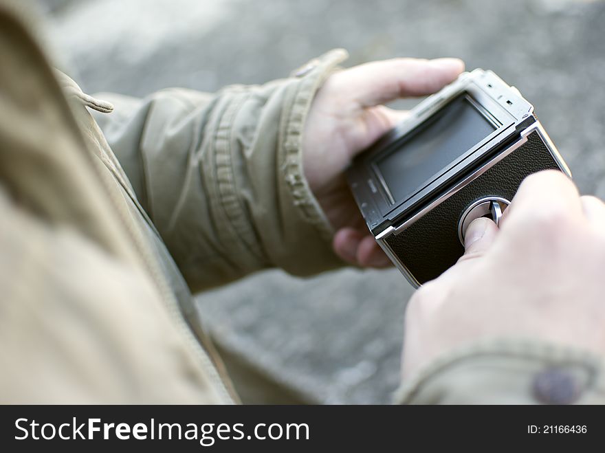 Male hands holding old fleshmeter, closeup