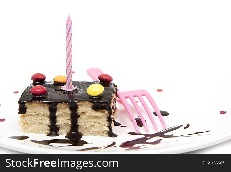 Delicious birthday cake with pink candle. Delicious birthday cake with pink candle