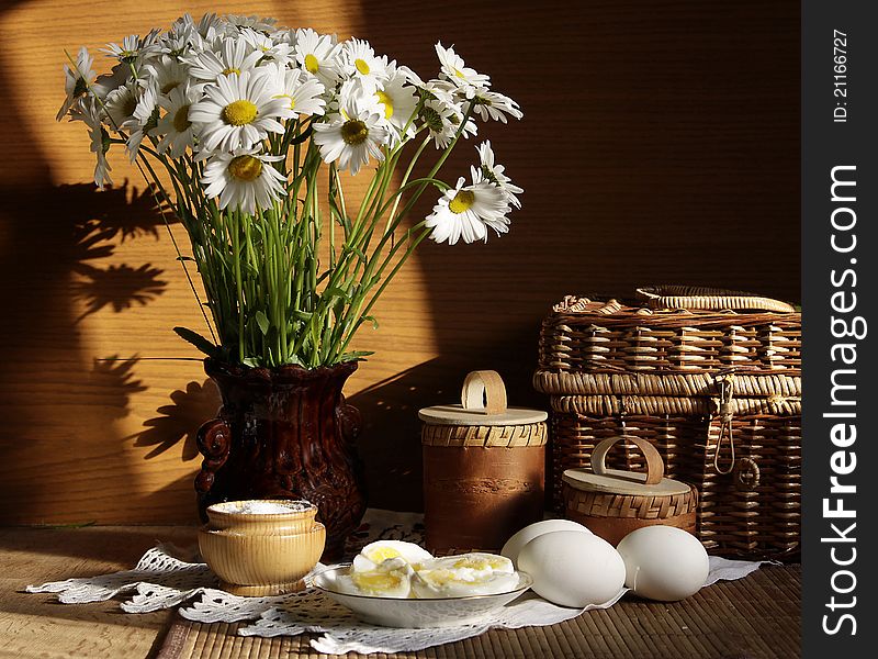 Meal, milk and flowers on a dining table. Meal, milk and flowers on a dining table.