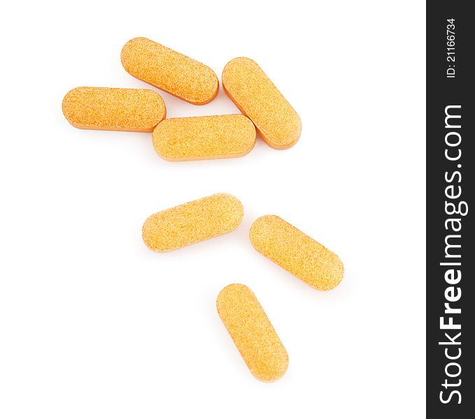 Orange medical pills isolated on white