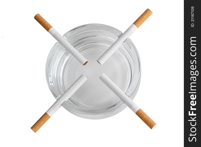 Color photo of a glass ashtray and cigarette