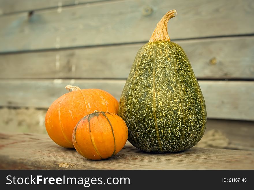 Pumpkins on a wooden background