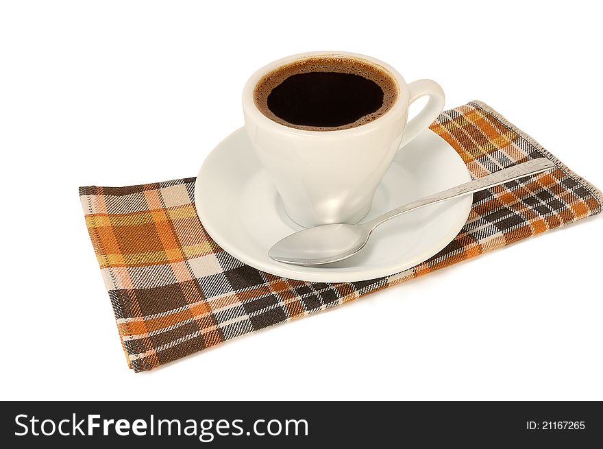 Cup of strong coffee on a napkin on a white background
