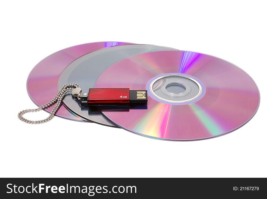 Computer disks and USB flash drive on a white background