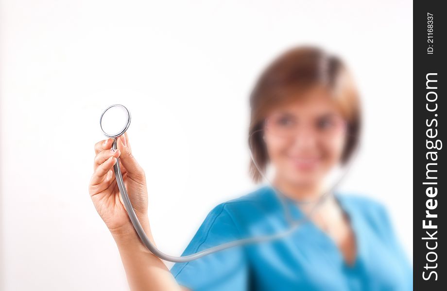 Medical doctor holding an stethoscope in focus on white background. Medical doctor holding an stethoscope in focus on white background