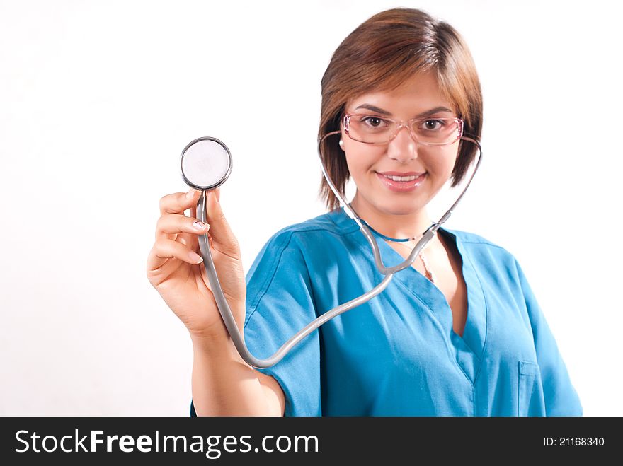 Medical doctor out of focus with stethoscope in focus on white background. Medical doctor out of focus with stethoscope in focus on white background