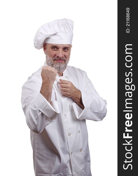 Portrait of a chef in a fighting stance in a chef's hat and uniform isolated on a white background.