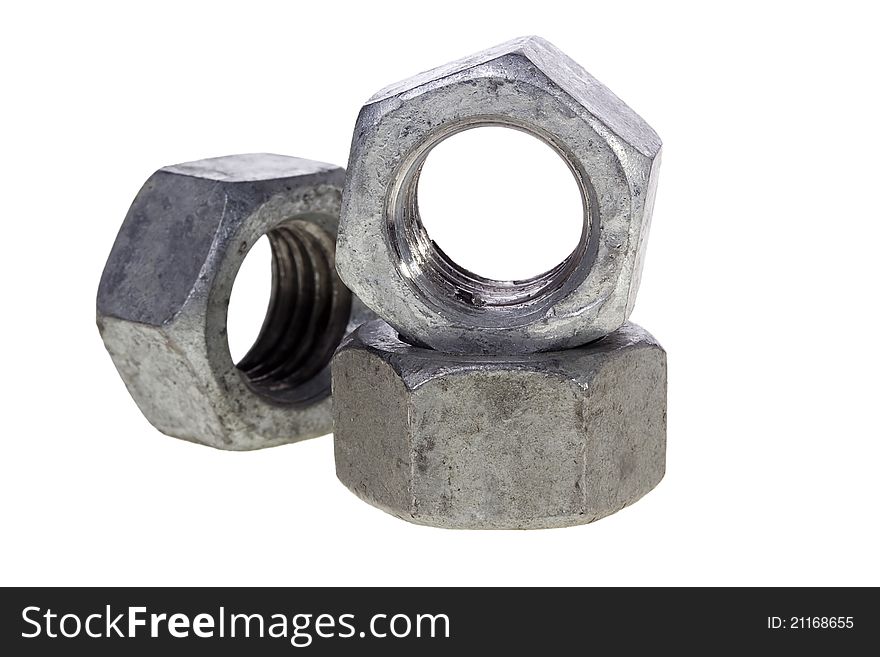 A few metal nuts isolated on a white background.