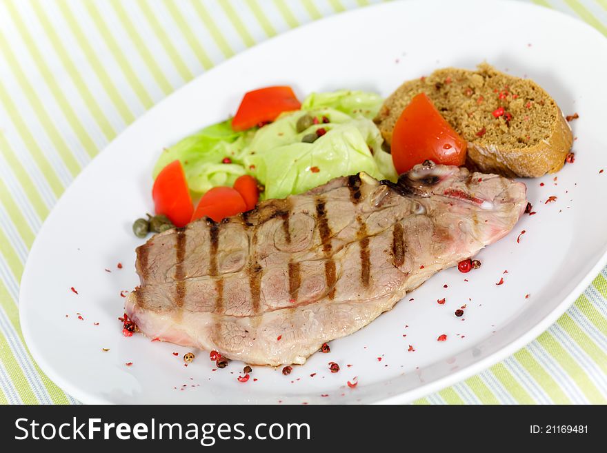 Pork Chop, Grilled ,with Salad,bun And Tomato