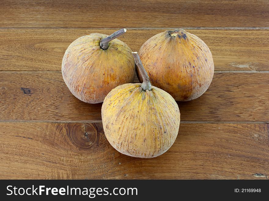 3 santol with teak wood background.