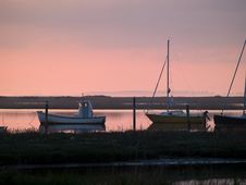 Boats In An Amazing Dramatic Sunset Stock Images Boats In An Amazing Dramatic Sunset Stock Images