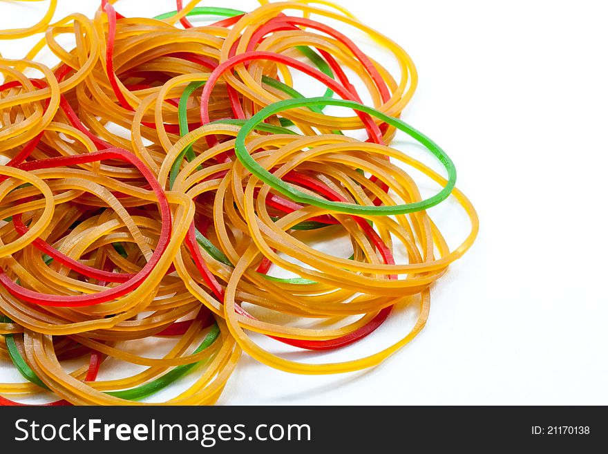 A pile of rubber bands on white background