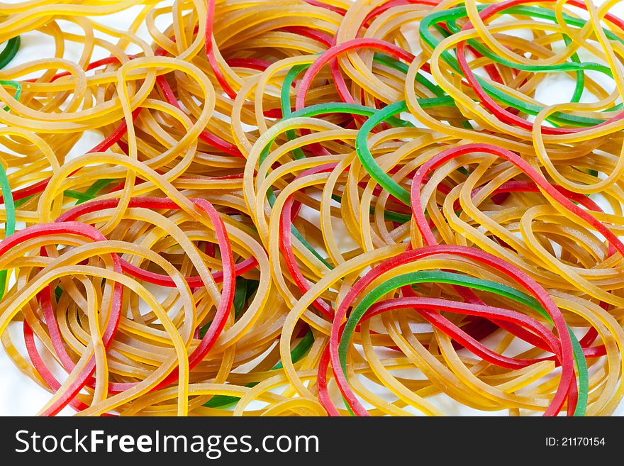 A pile of rubber bands on white background