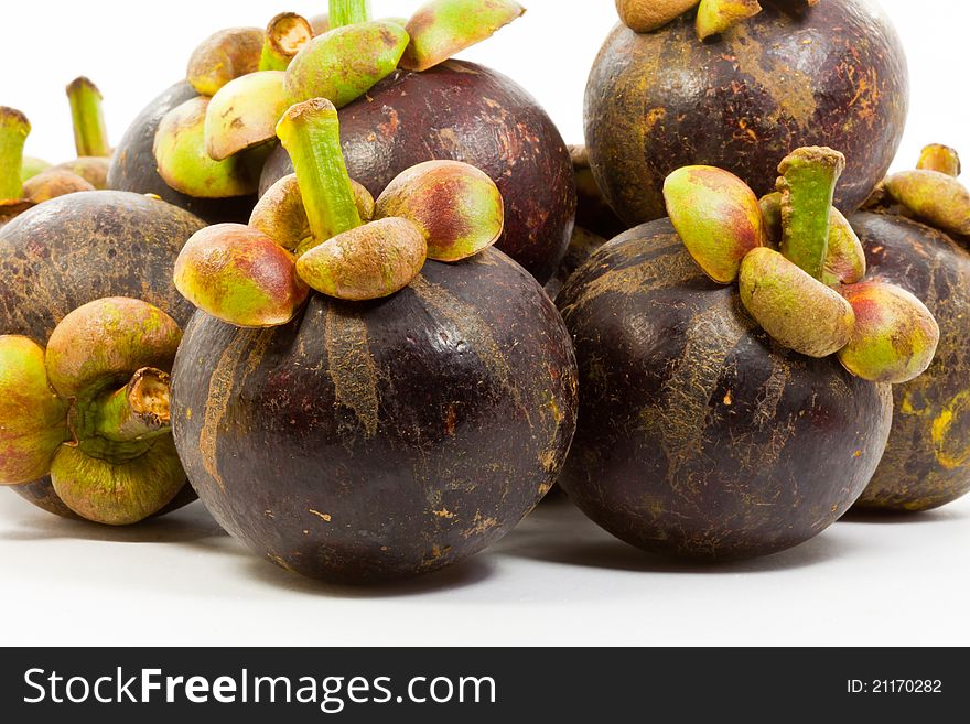 A pile of mangosteen on white background