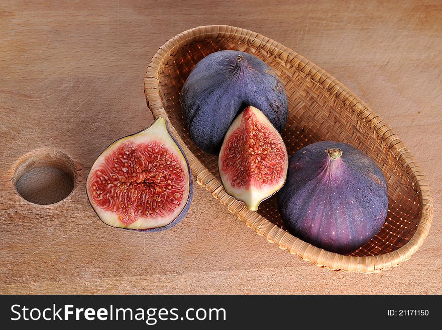 Slice fig on wood background. Slice fig on wood background