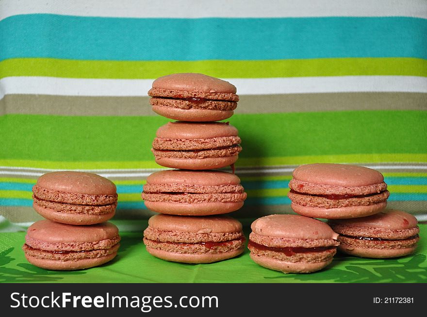 A lot of macarons on stripe background. A lot of macarons on stripe background.