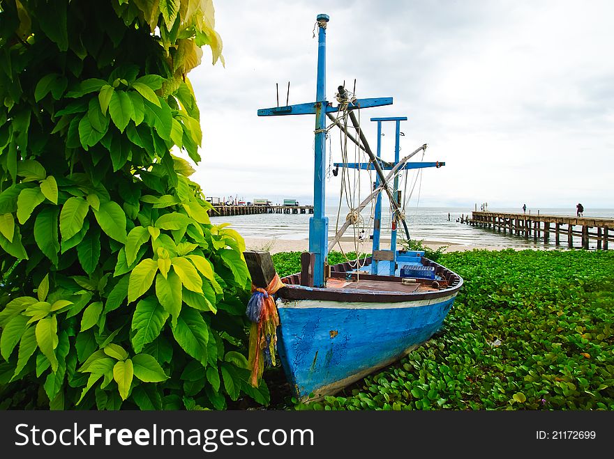 Fishing Boat With Leaf And Sea Background