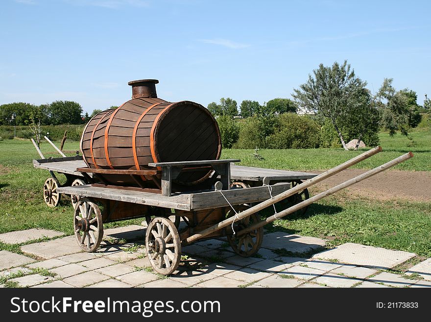 Old wooden barrel on cart