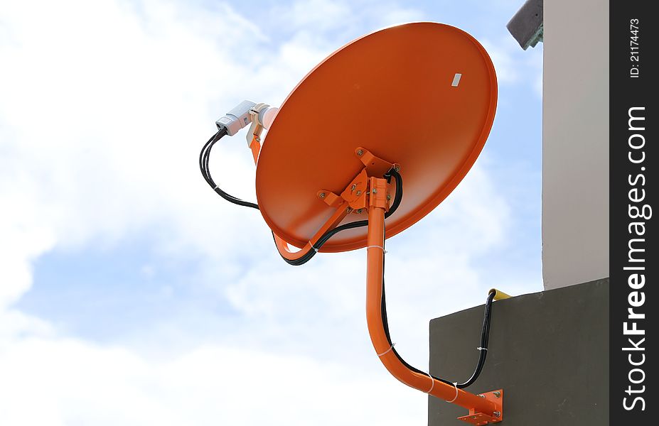 Satellite dish antenna on blue sky background