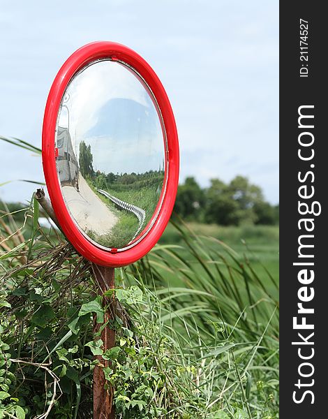 Security convex mirror reflecting on the road
