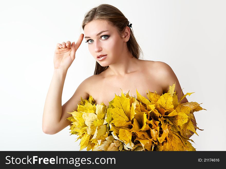 A girl with a wreath of autumn leaves. A girl with a wreath of autumn leaves.