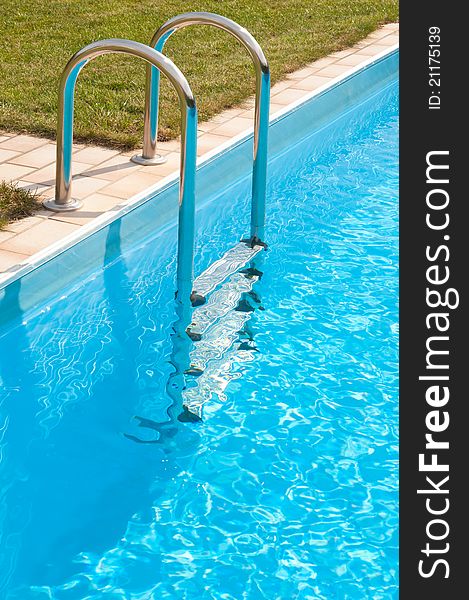 Pool with water and swim ladder