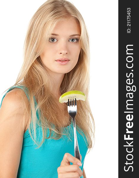 Blond female holding a slice of apple