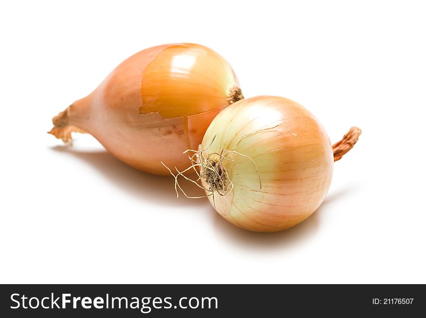Two yellow onions isolated on white background