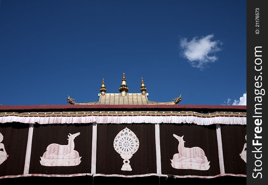 Part of Jokhang Temple and blue sky as background