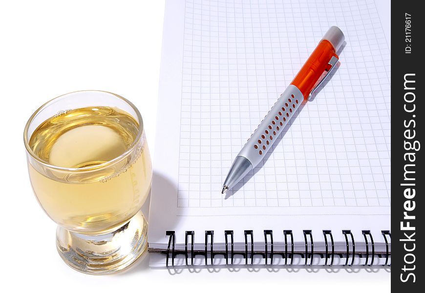 Color photo of glasses cup and empty notebook. Color photo of glasses cup and empty notebook