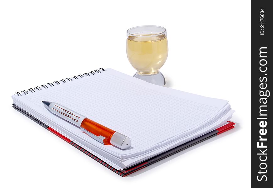 Color photo of glasses cup and empty notebook. Color photo of glasses cup and empty notebook