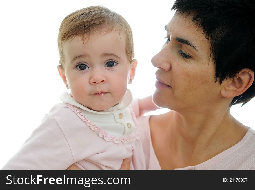 A mother playing with her little baby on white background. A mother playing with her little baby on white background