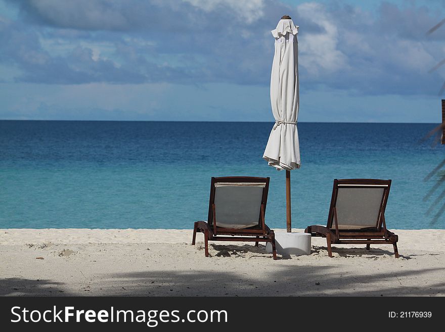 Seaside With Two Deck Chairs At Maldives