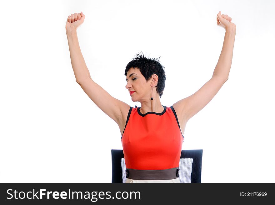 A picture of a successful woman with her arms up, smiling over white background