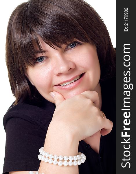 Smiling woman with pearl neacklace isolated over white